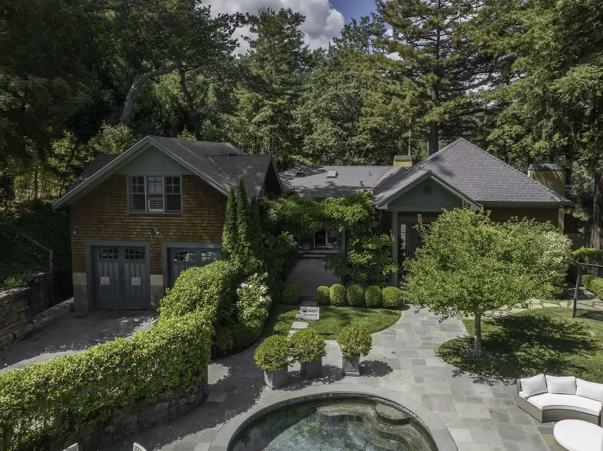 Wooded property with shingle roof replacement and landscaped pool