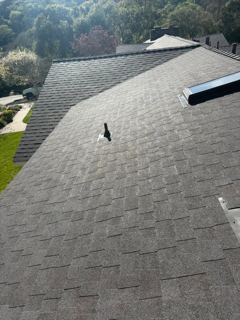 Close-up of fresh asphalt shingle roof install on a residential home