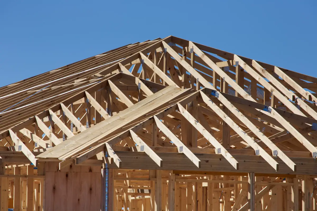 New construction roofing — house being built with framing visible